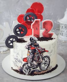 a birthday cake decorated with an image of a dirt bike rider