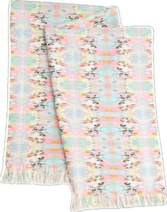 two blankets with fringes on them, one in pink and the other in blue