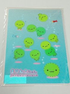 a sticker with green sea creatures on it