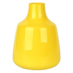 a yellow vase sitting on top of a white table