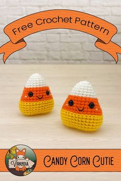 two crocheted candy corns are sitting on a table