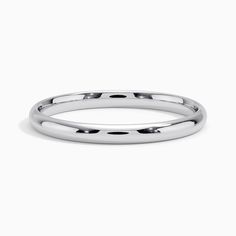 a white gold wedding band with black dots on the outside and inside, set in 18k white gold