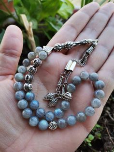 ✔️ This top quality personalized rosary made by using 8 mm round cut, AAA grade labradorite stone beads. ✔️ Natural Stone Tasbeeh ✔️ Natural Color Labradorite Misbaha ✔️ This customized tasbih is a very special gift for your loved ones. ✔️ Each order comes in a special box. ✔️ PLEASE CLICK THE LINK FOR ALL PRAYER BEADS MODELS https://www.etsy.com/shop/GoodJewelsofYazmasal Note: As a natural feature the stones beads may have some variations. SHIPPING: United States (Standart/DHL eCommerce/usps): Spiritual Round Rosary Bracelet With Polished Beads, Spiritual Beaded Rosary As Gift, Traditional Handmade Rosary Bracelet With Round Beads, Spiritual Rosary Bracelet With Gemstone Beads, Traditional Handmade Rosary Bracelet, Spiritual Rosary With Natural Stones As Gift, Traditional Rosary Bracelet With 8mm Beads As Gift, Handmade Spiritual Rosary With Oval Beads, Handmade Rosary Bracelet For Meditation