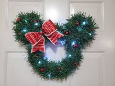 a wreath decorated with lights and bows