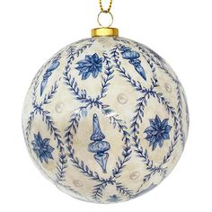 a blue and white ornament hanging from a gold chain