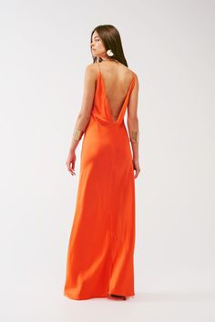 Step into the spotlight with this Satin Maxi Dress with Spaghetti Straps in Orange. Crafted from a luxurious blend of 95% Polyester and 5% Elastane, this eye-catching maxi dress features a flattering V-neck neckline and delicate spaghetti straps. With a relaxed fit, open back, and zip-back fastening, this stunning gown is perfect for any party or special occasion. Model is wearing size S with measurements: 31-24-35, height: 5'10''. Shop this exquisite piece at Szua Store today! Orange Long Dress Wedding, Satin Orange Dress, Orange Satin Dress, Orange Maxi Dress, Orange Satin, Wedding 2024, Style Party, Satin Maxi