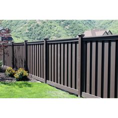 a black fence in front of a house