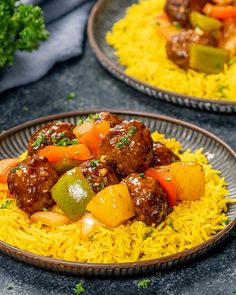 two plates filled with yellow rice and meatballs