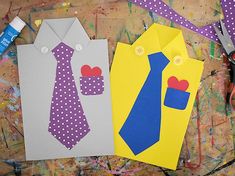 some paper cut outs with ties and hearts on them