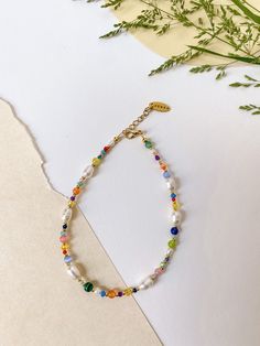 "★ FREE Worldwide Standard Shipping on ALL orders €40+ A fun and trendy delicate anklet with gorgeous colorful semi precious stones and crystals combined with white freshwater peals ♥  Freshwater pearls symbolize harmony and purity ★ Made with semi-precious stones, Austrian crystals and natural freshwater pearls  ★ Length: 36cm (14.2\") with 5cm (1.9\") extension ★ Handmade with love in the EU using high quality materials  If you have special inquiries or questions don't hesitate to message me :) ➸NOTE: Please note that due to different screen types, the colors may slightly defer. However you will love these natural stones even more once you see and touch them." White Anklets With Pearl Charm As Gift, Elegant Multicolor Anklets For Gift, Elegant Multicolor Anklet Gift, White Anklets With Colorful Beads As A Gift, White Anklets With Colorful Beads For Gift, Colorful Beaded White Anklets As Gift, Semi Precious Stone Jewelry, Crystal Anklet, Summer Anklets