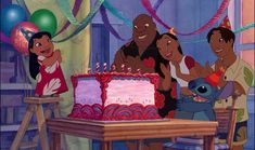 an animated family celebrating a birthday with a cake in the shape of a disney character