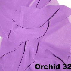 the fabric is purple and has white stitching on it, along with an orchid 32