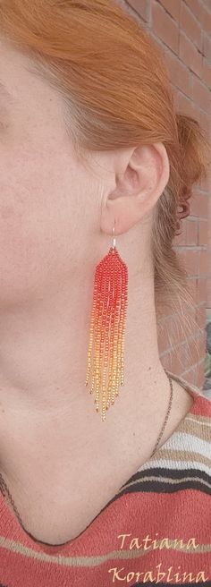 These handmade earrings are made of high-quality Czech beads and strong synthetic thread. They are elegant, fashionable, and highly versatile, suitable for everyday wear. Color: red, orange. There may be some color discrepancies which is due to the different monitor settings 100% hand made with love! Measurements: Length-about 11cm (4.3 inch) Width -about 2 cm (0.79 inch) Materials: Sterling silver components Czech glass beads Strong bead weaving thread Beaded Chandelier Earrings, Red Fringe, Orange Earrings, Buy Earrings, Earrings Red, Earrings Long, Seed Bead Earrings, Czech Beads, Fringe Earrings