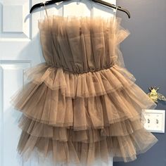 Mabl Size Small, Champagne Colored Tulle “Cupcake” Dress. Never Worn. Tags Still On. Satin Lined. Fits True To Size. Very Short. Sweet Party Dress With Ruffle Hem, Sweet Ruffled Dresses For Parties, Cute Tiered Mini Dress For Party, Sweet Ruffle Dress For Brunch, Cute Tiered Skirt Dress For Party, Sweet Ruffled Dress For Brunch, Spring Mini Tutu Dress With Ruffles, Sweet Sleeveless Ruffled Tutu Dress, Sweet Sleeveless Tutu Dress With Ruffles