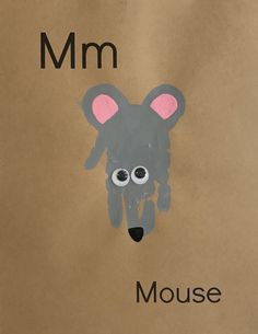 a brown paper bag with a drawing of a mouse on it's face and the word mm