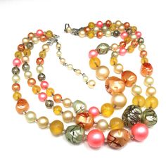 *Description: This is a beautiful Japan necklace which has a variety of multicolored round glass beads with accent art beads which have been hand painted so no two are alike. The necklace also has small bugle beads as spacers, from the 1950s. Japan necklaces have very unique and artistic bead accents. Each one is a beautiful piece of art and no two are alike. This would be a great addition to your vintage jewelry collection or make a great vintage gift! *Approximate Measurements: Length - 17 Inc Vintage Multi-strand Colorful Beaded Necklaces, Vintage Multi-strand Beaded Necklaces With Colorful Beads, Vintage Multi-strand Beaded Necklace With Colorful Beads, Vintage Czech Glass Beaded Necklace, Vintage Czech Glass Beaded Necklaces With Polished Beads, Vintage Beaded Necklaces With Colorful Beads, Vintage Multicolor Jewelry With Faceted Beads, Vintage Multicolor Multi-strand Beads, Vintage Multicolor Large Beads