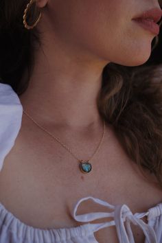 Discover the allure of the sea with a stunning Ocean-Inspired Labradorite Pendant. A beautiful labradorite stone flash, its palette of blue-green hues mirrors the mesmerizing waves of the ocean. Each pendant boasting a unique, iridescent play of color--just as no two waves are the same. The labradorite is securely held and beautifully accentuated by a gold-filled chain. The chain's length is thoughtfully designed to lay perfectly around the neckline, allowing the pendant to become a statement pi Delicate Labradorite Jewelry Gift, Dainty Labradorite Jewelry Gift, Gold Necklaces With Natural Labradorite Stones, Elegant Gold Necklace With Labradorite, Labradorite Jewelry With Raw Stone As Gift, Teardrop Labradorite Jewelry Gift, Labradorite Stone Pendant Necklace, Gold Labradorite Pendant Jewelry, Labradorite Teardrop Pendant Jewelry Gift