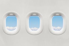 the view from an airplane window shows clouds and blue sky