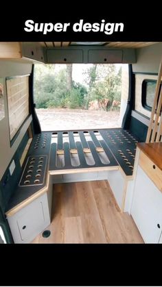 an interior view of a camper with the bed made out of wood and metal