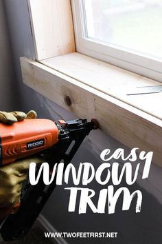 a window trimer sitting on top of a ladder next to a window with the words easy