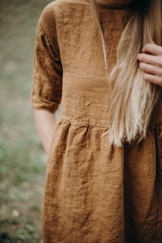 This loose fit linen dress not only looks great for everyday wear, but is so comfy too! Made from soft washed organic linen it feels extremely smooth and pleasant on the skin. For easy and comfortable wear we've made the neckline large enough to fit in. * Loose and relaxed dress can fit all types of figures * Hidden pockets on the side seams * Handmade from 100% natural washed and soft medium weight OEKO-TEX certified linen * Washed and soft medium weight linen (160g) * Linen is long lasting. Po Loose Linen Dress, Fall Linen Dress, Fall Linen Outfits, Modest Linen Dress, Nothing Fits But Dress, Brown Embroidered Cotton Dresses, Spring Tunic Dress With Yoke Detail, Brown Relaxed Fit Cotton Dress, Linen Summer Dresses