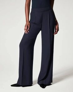 Smooth, likely synthetic Neutral tan palette High-waisted design Tailored flare style Formal or business Pair with fitted tops Celana Kargo, Paperbag Hose, Celana Fashion, Legging Jeans, Casual Wide Leg Pants, Costume Intero, Estilo Chic, Flare Trousers, Pantalon Large