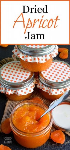 an orange jar filled with apricot jam on top of a cloth covered table