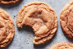 several cookies with sugar on top and one half eaten