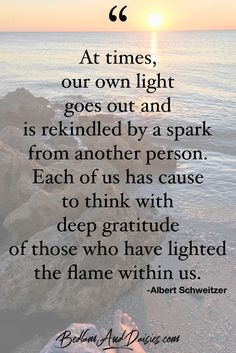 the sun is setting over the ocean with a poem written on it that reads at times, our own light goes out and is included by a spark from another person