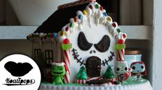 a decorated gingerbread house with candy canes on it's roof and decorations