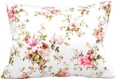 a white pillow with pink flowers on it