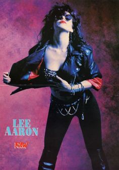 a woman in black leather clothes posing for a magazine cover with her hands on her hips