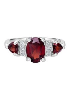 This exquisite ring, crafted from polished sterling silver, exudes elegance and sophistication. Designed for women, it features a slip-on closure for effortless wear. The centerpiece of this ring is the stunning three-stone design, adorned with a vibrant garnet and two shimmering white topaz gemstones. Each stone is meticulously set to enhance its brilliance and capture the light beautifully. With its timeless design and exceptional craftsmanship, this ring is sure to become a cherished addition to any jewelry collection. | Belk Sterling Silver Sterling Silver Garnet and White Topaz 3 Stone Ring, 9 3 Stone Ring, 3 Stone Rings, Rings Jewelry Fashion, Stone Design, Topaz Gemstone, Stainless Steel Band, White Topaz, Stone Ring, Womens Jewelry Rings