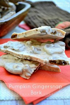 pumpkin ginger snapsnap bark is stacked on top of an orange napkin with the words,