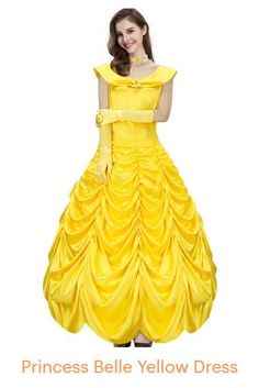 a woman in a yellow dress is posing for the camera with her hands on her hips