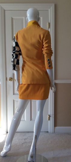 "This vintage Moschino skirt is in his iconic taxi cab/school bus yellow. Fully lined in yellow rayon. Side zipper with self button. Front and back shaping seams. Measurements - Waist - 27' Hips - 36\" Length - 18\"" Fall Fitted Mini Length Skirt Suit, Fall Mini Length Fitted Skirt Suit, Fall Fitted Mini Skirt Suit, Fitted Mini Skirt Suit For Fall, Retro Fitted Mini Skirt For Fall, Chic Yellow Mini Skirt For Work, Fitted Retro Yellow Mini Skirt, Retro Yellow Fitted Mini Skirt, Fitted Yellow Pleated Mini Skirt