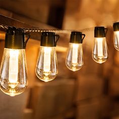 solar powered string lights are hanging from a wooden beam with the words warm white light on it