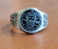 This ring depicts the First Pentacle of the Sun seal from The Key of Solomon. This pentacle is able to make creatures obey and the Angelic Spirits do reverence on bended knees. The ring has a silver color and has been blackened in the backgrounds of the main design and band to provide contrast. All of our rings are 100% Lead and nickel free pewter and made in the USA. The top design part of the ring measures about 15 mm in diameter. The ring band tapers from about 15mm to about 4.5mm at the bott Key Of Solomon, Pewter Ring, Seal Of Solomon, Sun Ring, Talisman Jewelry, Pagan Jewelry, Velvet Bag, Top Design, Stainless Steel Rings