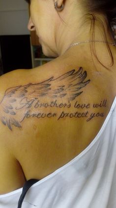 a woman with a tattoo on her back that says, brother's love will forever protect you