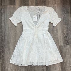 New Lunik White Eyelet Quarter Sleeve Mini Dress -Size Small -Brand New With Tags -Is Missing One Button As Pictured Short Sleeve Mini Dress With Buttons For Brunch, White Eyelet, Mini Dress With Sleeves, Quarter Sleeve, New Dress, Color White, Mini Dress, Brand New, Womens Dresses