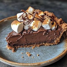 a slice of chocolate pie with marshmallows on top