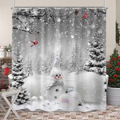 a shower curtain with a snowman and christmas trees in the background