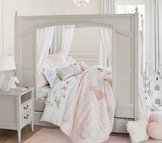 a bedroom with white walls and pink carpet