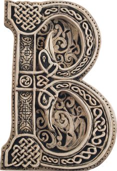 the letter b is made up of intricately carved wood and decorated with celtic designs