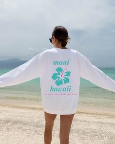 "The perfect chance to wear A Maui Hawaii, the sun is warm and the surf is hot Sweatshirt. This makes a great way to have soft cozy oversized beach travel sweatshirt. For anyone that adores: Hawaii, Hikes, Beach, Ocean, Snorkeling and celebrating Aloha this is for you!  Gildan 18000 Sweatshirt  Unisex Adult Sizing  Listing includes: Sweatshirt Only  50% Cotton, 50% Polyester Made To Order:  This is a Direct-To-Garment item and the ink is printed into the fabric, which prevents cracking and peeli White Screen Print Sweatshirt For Summer, White Long Sleeve T-shirt For Beach Season, White Hawaiian Surfing Top, White Tropical Surfing Top, White Letter Print Sweatshirt For Beach Season, White Sweatshirt For Beach Season Vacation, White Letter Print Sweatshirt For Vacation, White Relaxed Fit Sweatshirt For Beach Season, White Relaxed Fit Sweatshirt For Beach