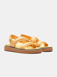 The favorite sandals of street-style? The ROAD PEACH, designed with Nappa leather straps to be the must-have of the season. Their molded insole, elevated rubber sole in pastel yellow, and slingback silhouette make them perfect for strolling through your favorite city, going to work, or a date with your friends. The contrasting embossed logo adds an elegant touch. Pair them with your favorite dress or denim for a casual-chic look. Style: Slingback sandals with two straps. Sole Height: 4.5 cm. Look Casual Chic, Slingback Sandals, Pastel Yellow, The Favorite, Slingback Sandal, Favorite City, Velcro Straps, Embossed Logo, Favorite Dress