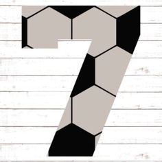 the number seven is made up of black and white hexagonal shapes