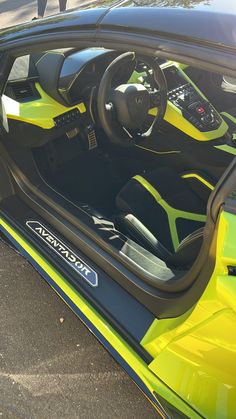 the interior of a yellow and black sports car