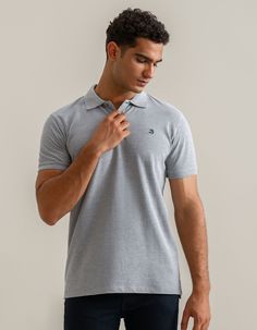 This plain grey polo shirt is a wardrobe essential, bringing versatility, style, and comfort within a single shirt. Crafted from breathable, sustainable cotton, this shirt ensures a natural, hypoallergenic experience. Pair this grey polo effortlessly with our stylish pair of jeans or chic shorts. 100% Cotton Contrast tape on vent and collar Regular fit Soft fabric finish Flat knit collar and ribbed cuffs 2-Button placket Anti-pilling fabric Tennis tail Chic Shorts, Grey Plain, Polo Fashion, Check Shirts, Polo Design, Single Shirt, Maroon Shirts, Grey Polo Shirt, Plain Shirts