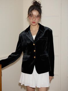 This product, the Classic Velvet Collar Jacket, is a luxurious piece that brings opulence and style to any outfit. The rich texture of the velvet is complemented by the jacket's structured silhouette and the contrast of elegant gold buttons. Perfect for adding a touch of sophistication to both day and night ensembles, this jacket is a must-have for those looking to make a sartorial statement. - The plush velvet material offers a sumptuous feel and a lustrous appearance that catches the light beautifully.- A sharp collar and tailored fit provide a classic look that is both versatile and fashion-forward.- Gold-toned buttons add a chic and decorative touch while offering a contrast to the jacket's dark hue.- This jacket's timeless design ensures it can be worn season after season, making Velvet Single Breasted Outerwear For Fall, Luxury Velvet Outerwear For Fall, Single Breasted Velvet Outerwear For Fall, Single-breasted Velvet Outerwear For Fall, Winter Velvet Outerwear With Suit Collar, Velvet Outerwear With Suit Collar For Winter, Semi-formal Winter Outerwear With Gold Buttons, Velvet Suit Collar Outerwear For Winter, Evening Velvet Outerwear With Lapel Collar